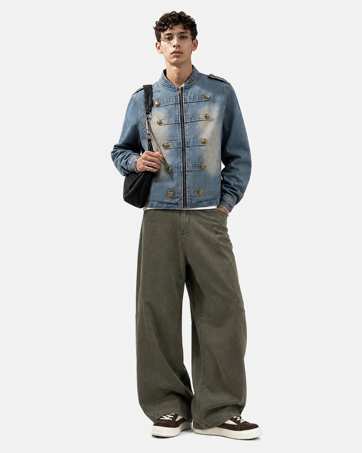 Napoleon-style washed denim jacket with mandarin collar and buttoned front tabs