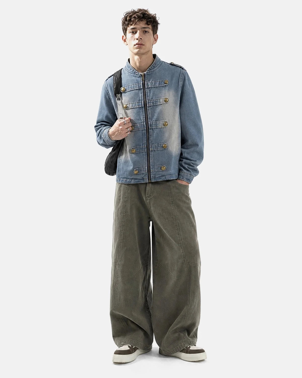 Napoleon-style washed denim jacket with mandarin collar and buttoned front tabs