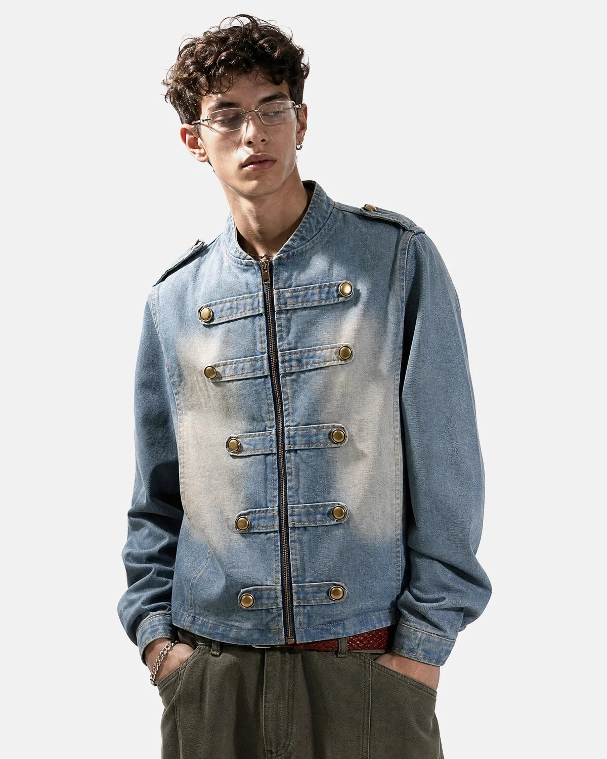 Napoleon-style washed denim jacket with mandarin collar and buttoned front tabs