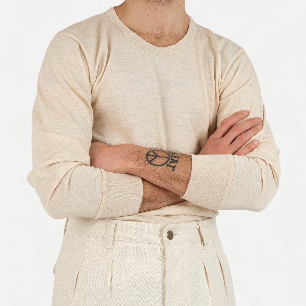Men's beige long-sleeve crew-neck top with ribbed cuffs