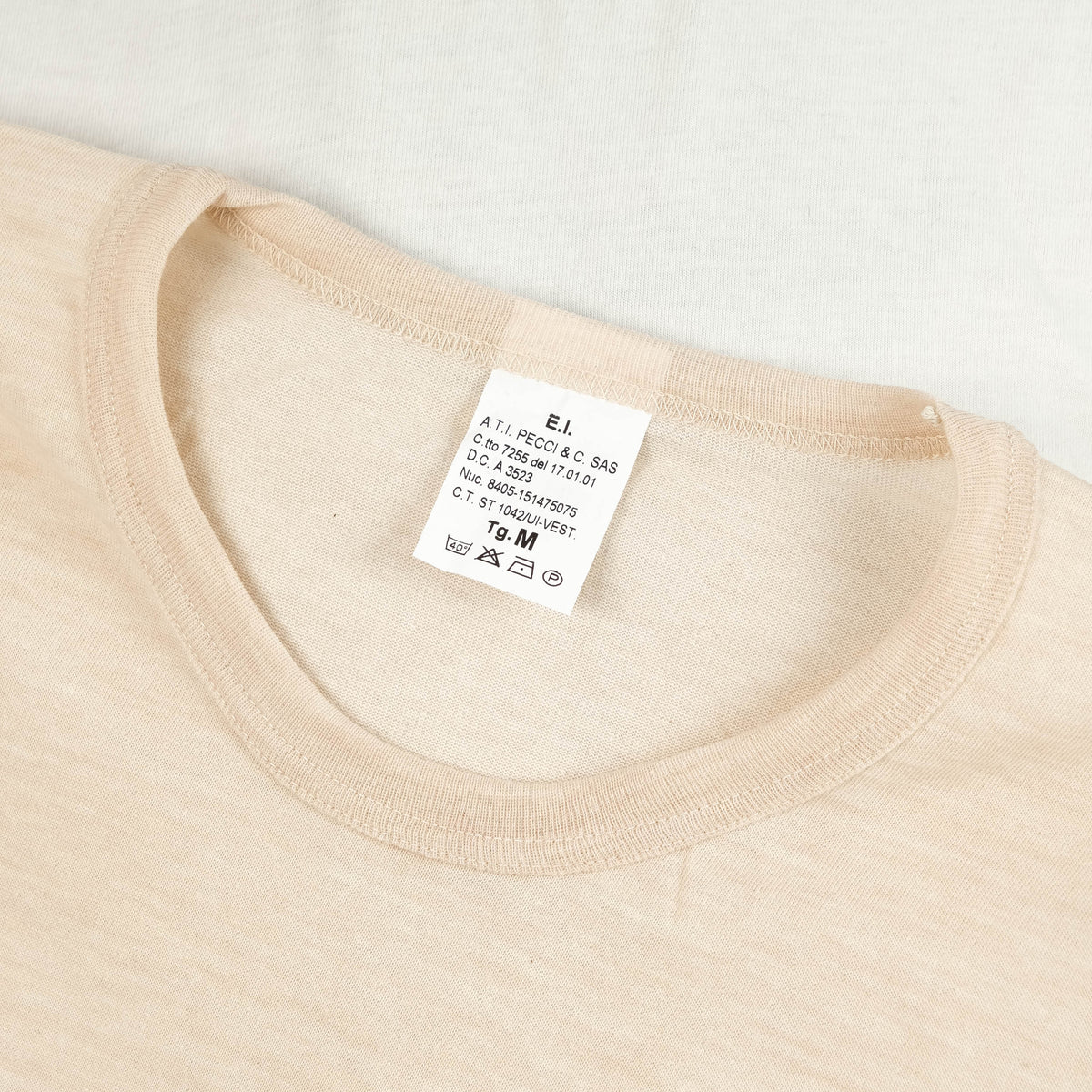 Men's beige long-sleeve crew-neck top with ribbed cuffs