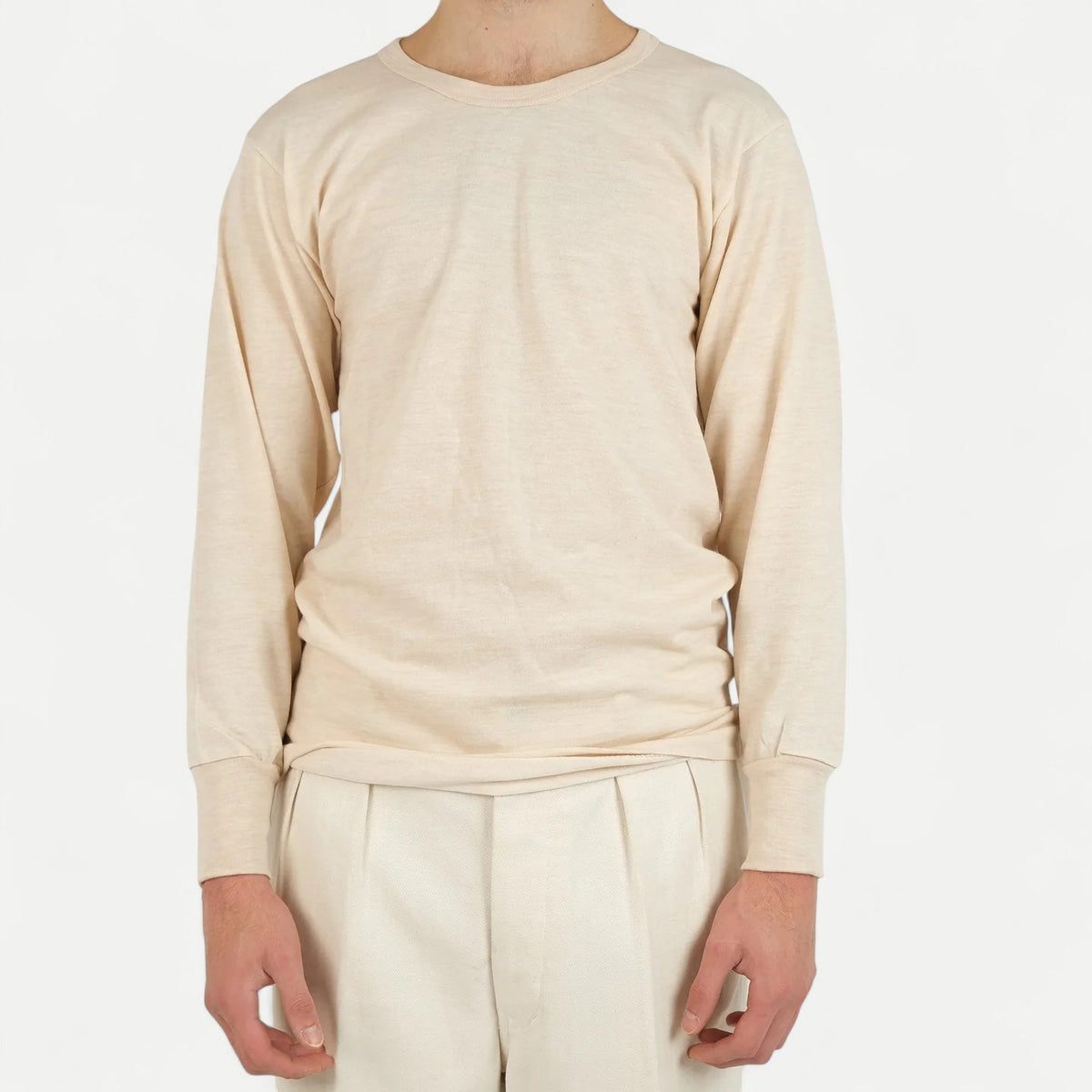 Men's beige long-sleeve crew-neck top with ribbed cuffs