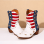 Ivory-white cowboy boots with red striped shafts, blue star panels and brown block heels