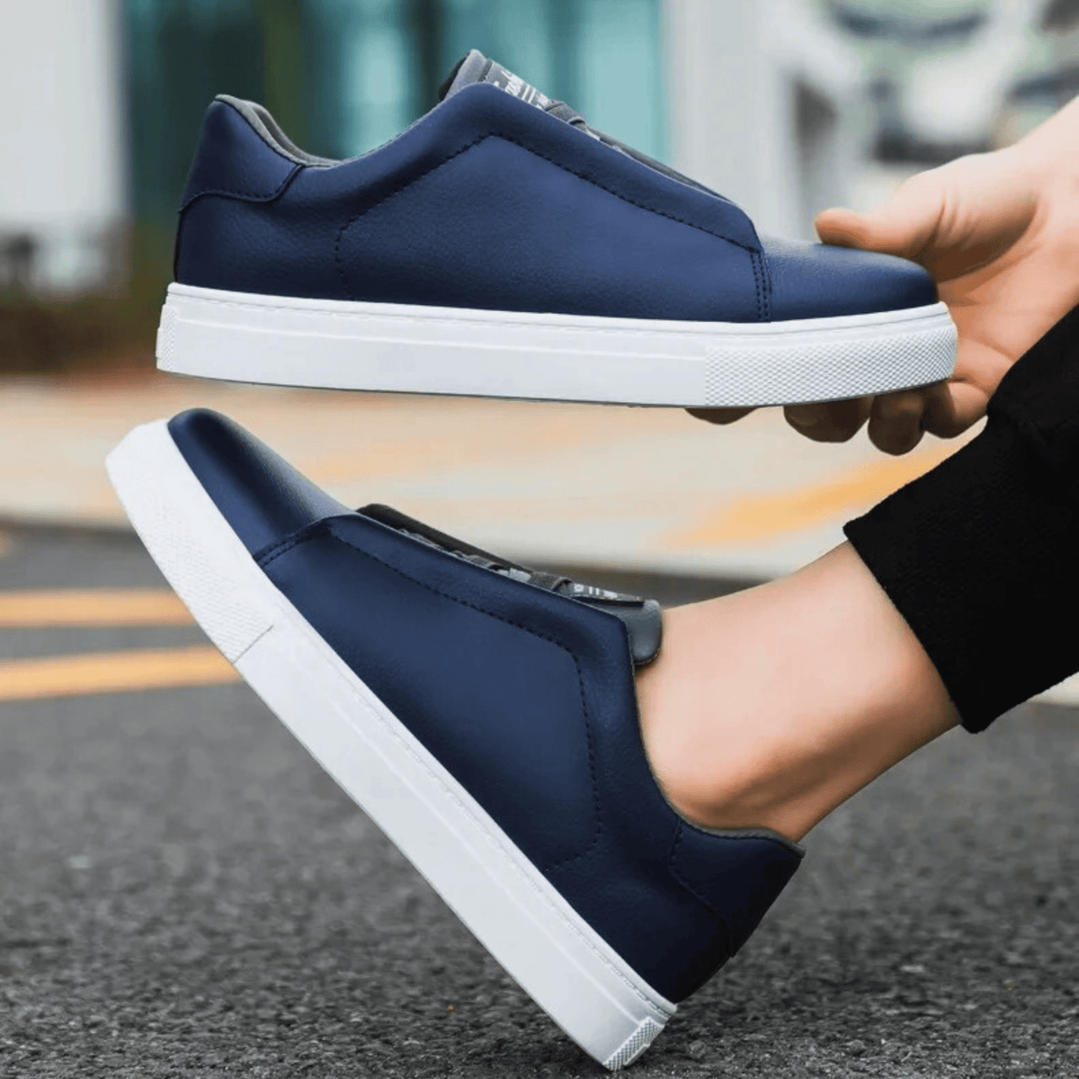 Low-top lace-up sneaker with contrast panelled upper and flat sole
